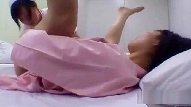 Japanese MILF Gets Her Body Washed and Kisses the Nurse on the Bed