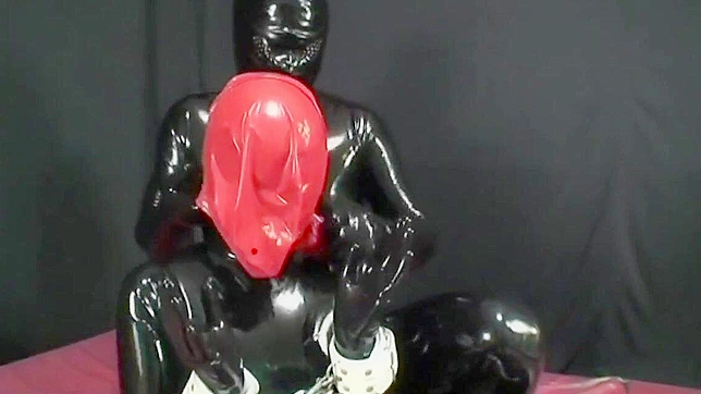 Japanese Beauty Undergoes Tough Love Training in Rubber Suit