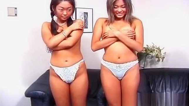 Experience the Allure of Luscious Asian Lesbians in this Stimulating Threesome Video - Part 6