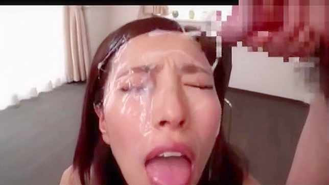 Japanese Beauty Drenched in jizz - A Must-See!