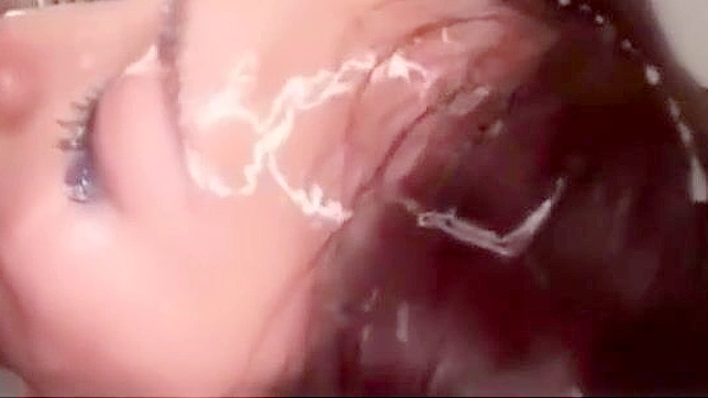 Japanese Beauty Drenched in jizz - A Must-See!