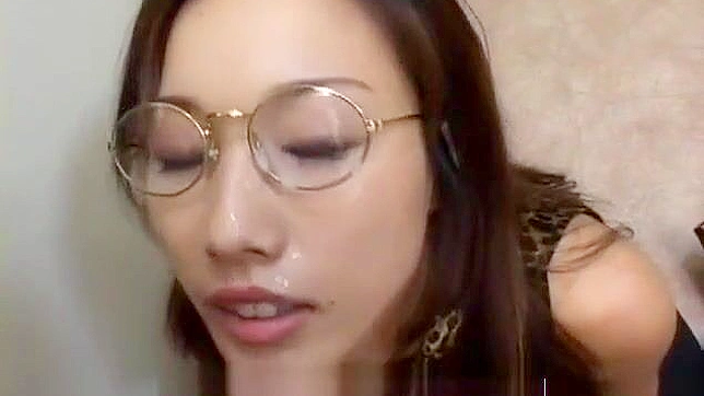 Japanese Beauty Gets Cummed on Her Glasses at a Bukkake Gangbang