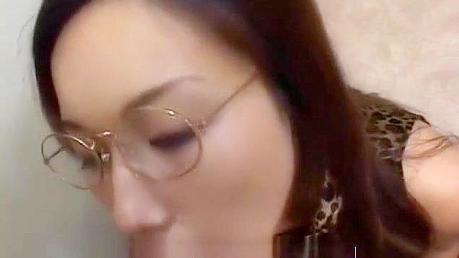 Japanese Beauty Gets Cummed on Her Glasses at a Bukkake Gangbang