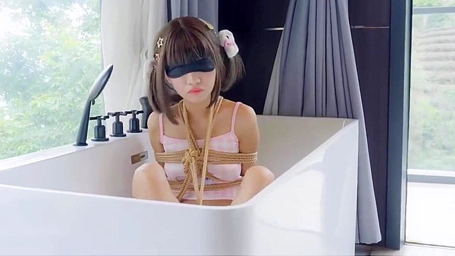 Soak in the Allure of an Enchanting Asian Beauty in this Steamy Bathtub Video!