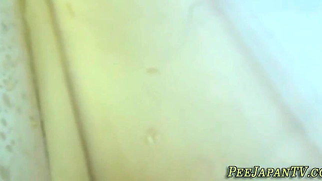 Japanese Beauty Peeing in a Receptacle - Must See!