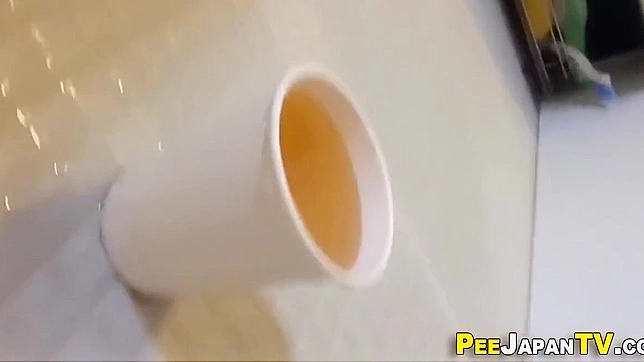 Japanese Porn ~ Peeing In Cup - A Must-Watch Fetish Video!