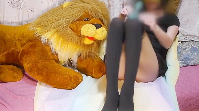 Japanese Beauty in Stunning Pantyhose Teases with Toy Lion and Massager for Your Pleasure