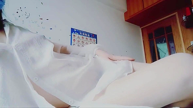 Wow, I can't wait to watch this one! A seductive woman in a white dress pleasures herself in a luxurious bedroom