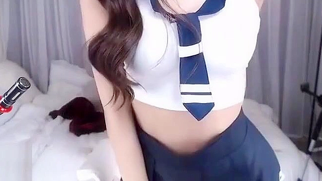 Korean Teen BJ in a Sexy Uniform Pleasures Herself with a Wild Masturbation Show.