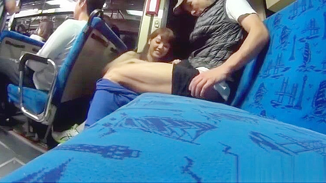 Busty Japanese Babe Gives a Public Handjob to a Lucky Passenger on the Bus.