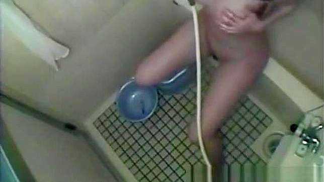 Nurse Masturbates in the Dorm Bathroom, Playing with Her Wet Pussy.