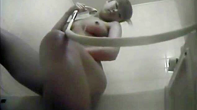 Nurse Masturbates in the Dorm Bathroom, Playing with Her Wet Pussy.