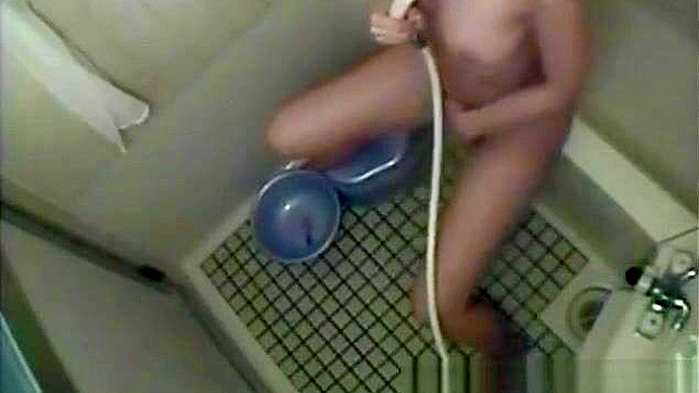 Nurse Masturbates in the Dorm Bathroom, Playing with Her Wet Pussy.