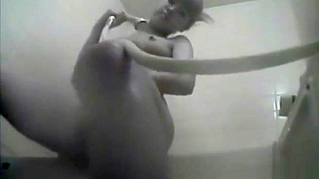 Nurse Masturbates in the Dorm Bathroom, Playing with Her Wet Pussy.