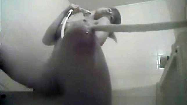 Nurse Masturbates in the Dorm Bathroom, Playing with Her Wet Pussy.