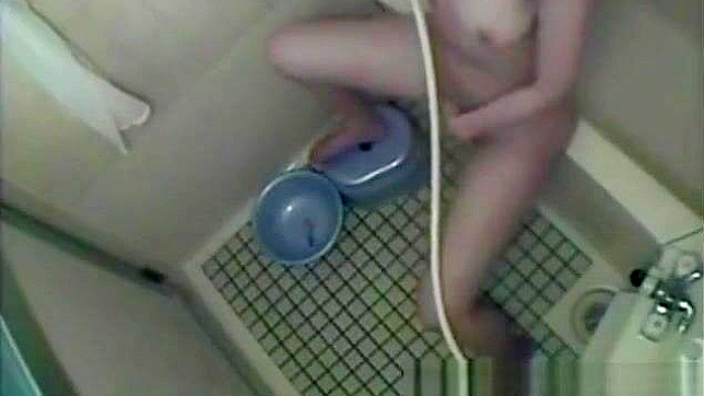 Nurse Masturbates in the Dorm Bathroom, Playing with Her Wet Pussy.