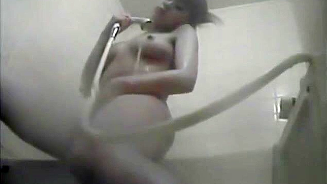 Nurse Masturbates in the Dorm Bathroom, Playing with Her Wet Pussy.