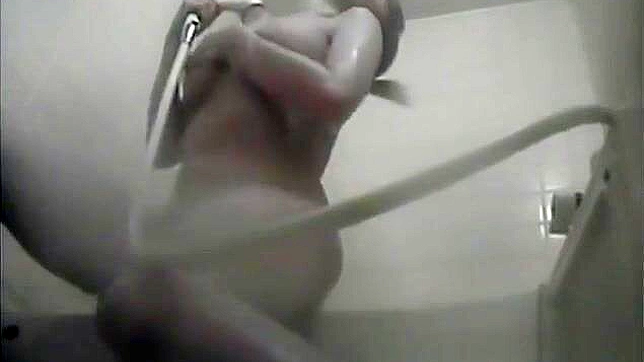 Nurse Masturbates in the Dorm Bathroom, Playing with Her Wet Pussy.