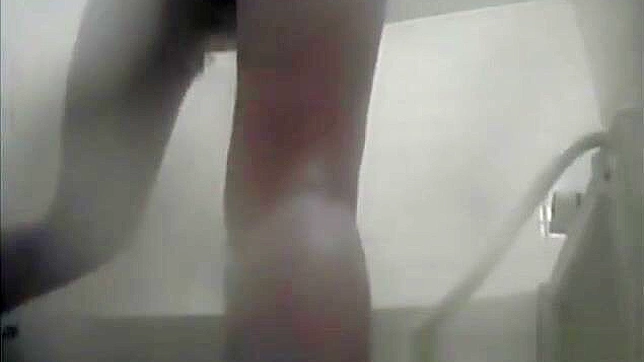 Nurse Masturbates in the Dorm Bathroom, Playing with Her Wet Pussy.