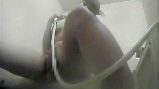 Nurse Masturbates in the Dorm Bathroom, Playing with Her Wet Pussy.