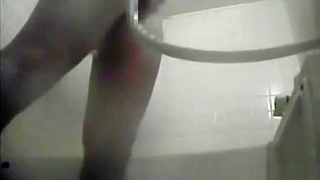 Nurse Masturbates in the Dorm Bathroom, Playing with Her Wet Pussy.