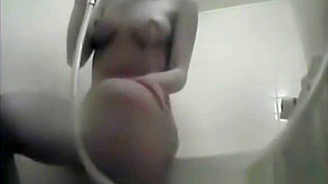 Nurse Masturbates in the Dorm Bathroom, Playing with Her Wet Pussy.