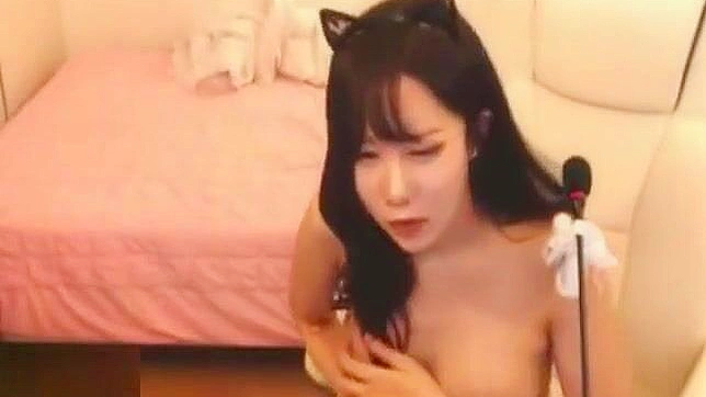 Busty Korean Camgirl Kitty Teases and Pleasures Herself with Wild Masturbation.