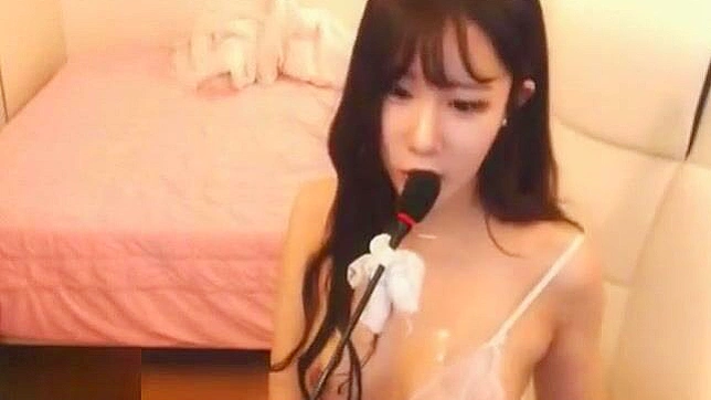 Busty Korean Camgirl Kitty Teases and Pleasures Herself with Wild Masturbation.