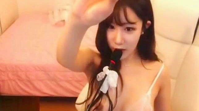 Busty Korean Camgirl Kitty Teases and Pleasures Herself with Wild Masturbation.