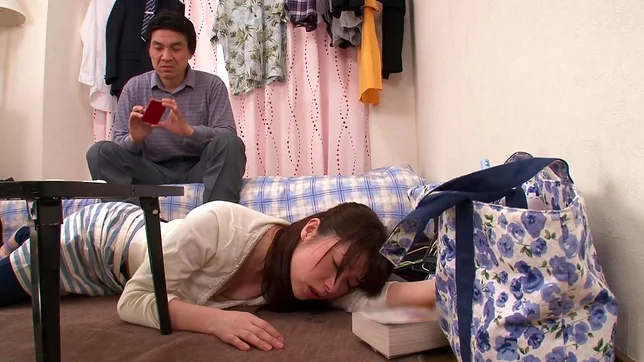 Lustful Japanese milf in black pantyhose spreads her legs