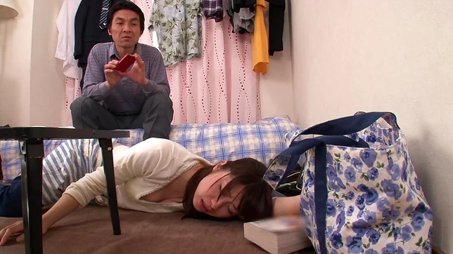 Lustful Japanese milf in black pantyhose spreads her legs