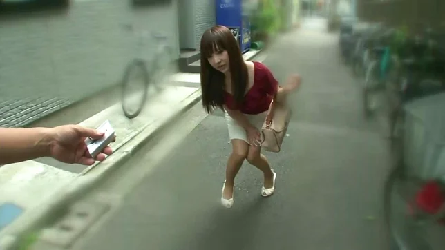 Red dressed volyball Japaneses girl is giving a blowjob in public place 3