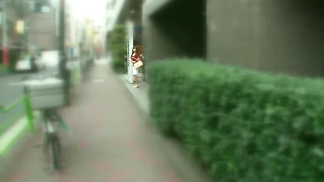 Red dressed volyball Japaneses girl is giving a blowjob in public place 3