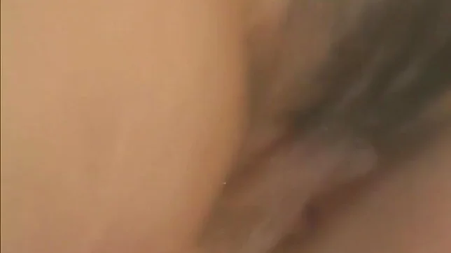 Pretty Japanese model fondles her wet pussy