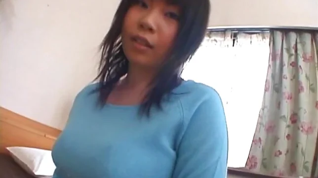 Asian model has a sexy huge set of boobs