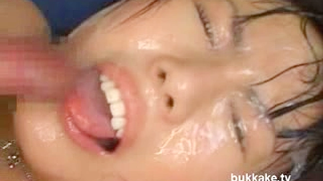 Busty  gets covered in jizz after Asian bukkake