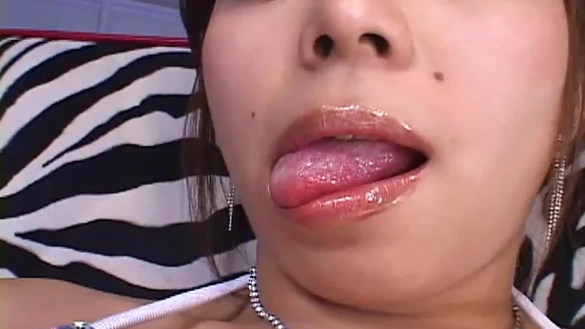 Japanese MILF Oils Up Her Big Tits And Massages Them 2