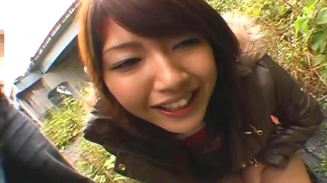 Erika Satoh Lovely Asian doll gives a blow job outdoors 2