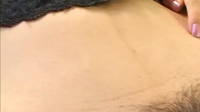 Pretty Japanese model fondles her wet pussy 3