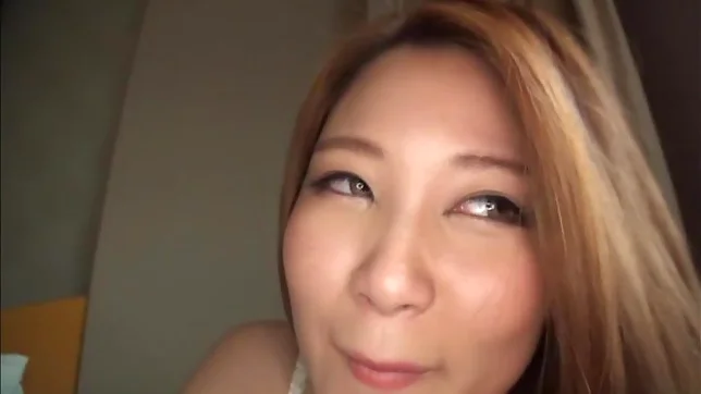 Big booty Asian babe plays with toys on the bed 4