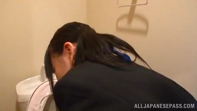 Hot Japanese milf in sexy uniform loving herself