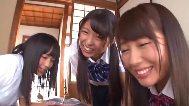 Three pretty Tokyo schoolgirls share a dick and enjoy titfuck