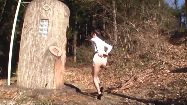 Hot Asian babe flashes and gives head in the woods