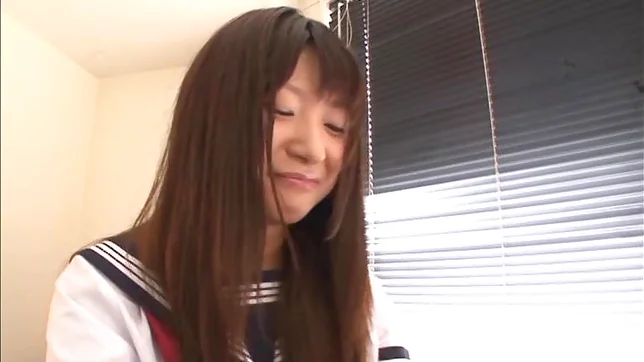Attractive Japanese schoolgirl Rio Ogawa gives a handjob 2