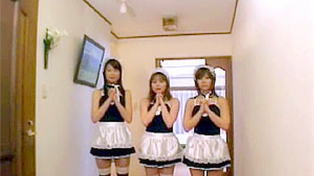 Three kinky Asian girls dressed as maids jerking a guy off