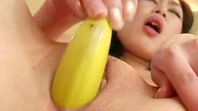 Cute Asian teen drills her snatch with a banana